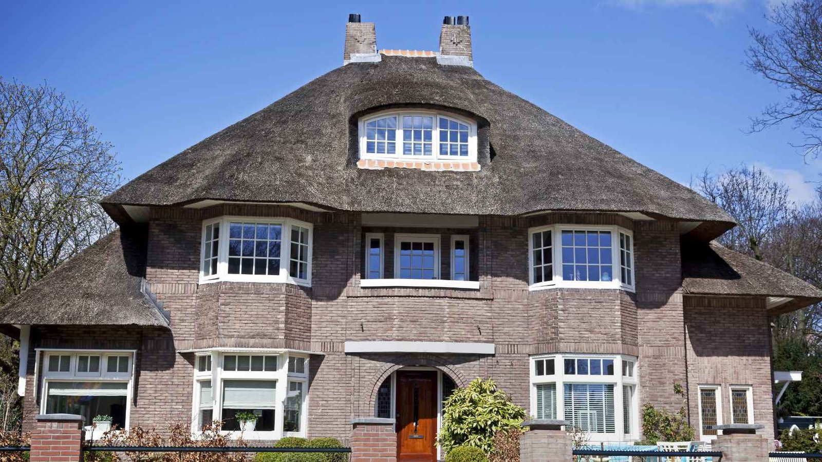 Shingle-roofed house with chimneys