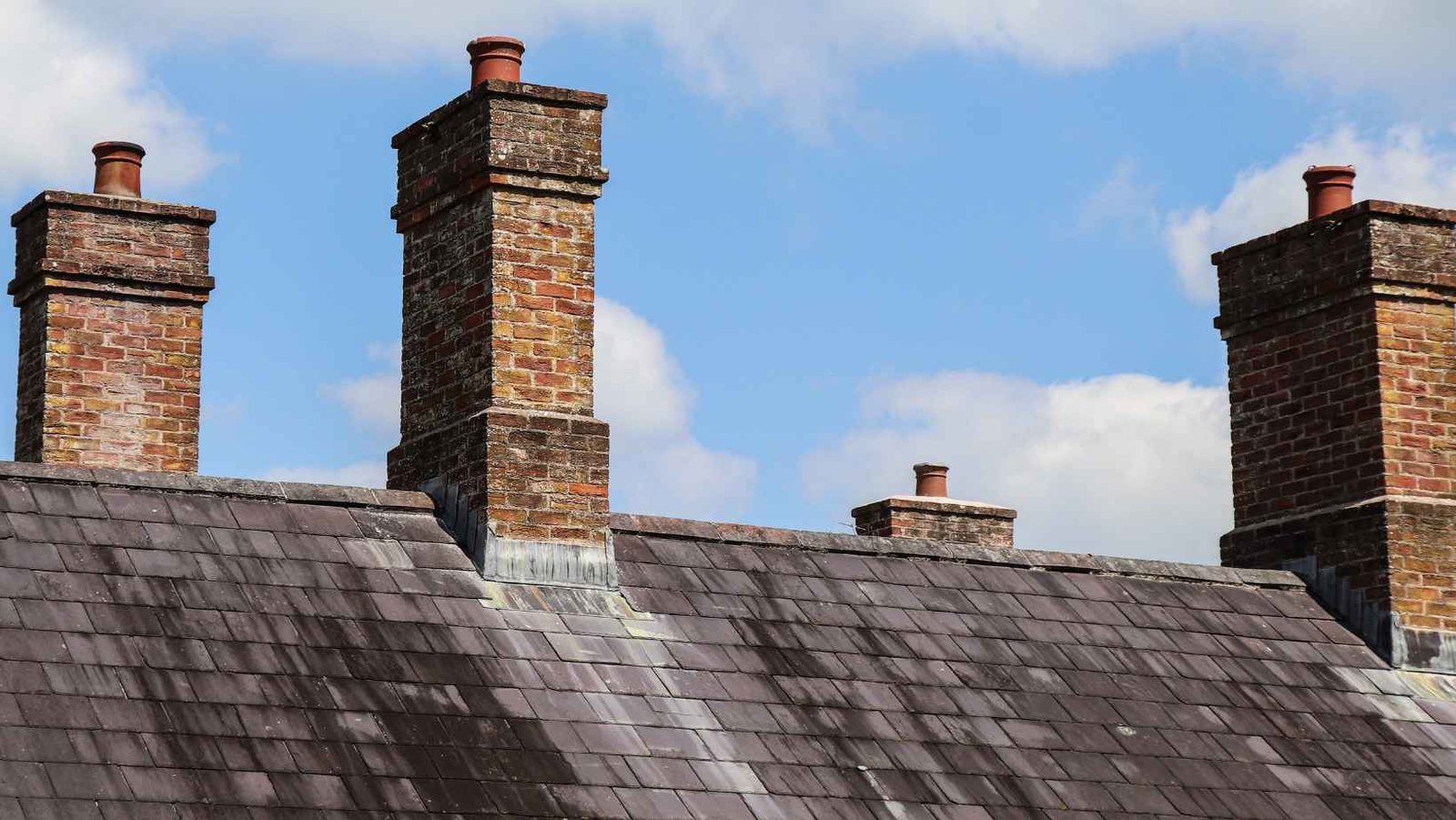 Brick chimney stacks on a slate roof