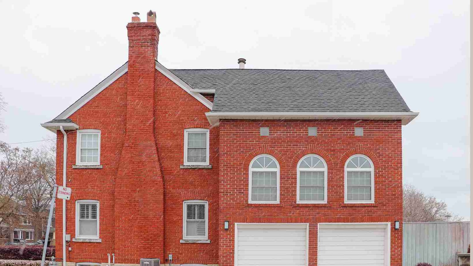 Two-story brick house with a chimney