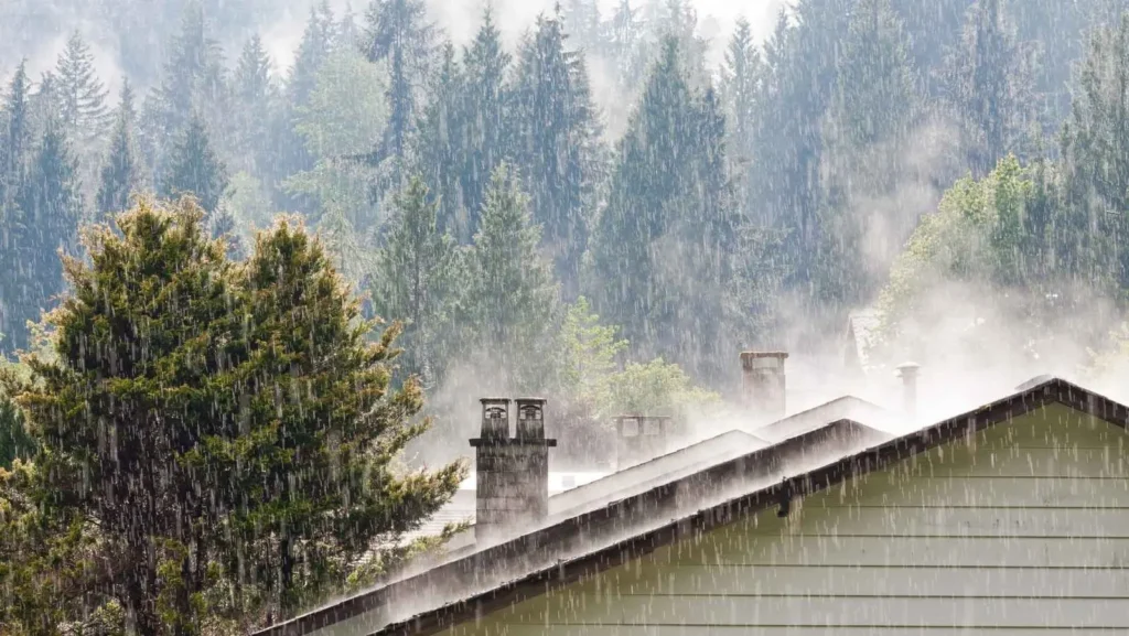 Rain on a roof around a chimney
